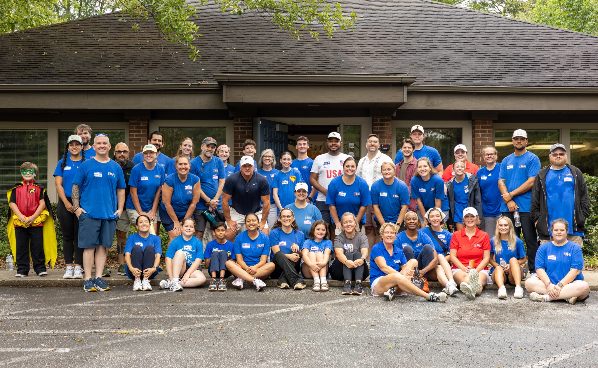 CFS team members and volunteers gathered outside the Greenville office at the 2026 backpack drive